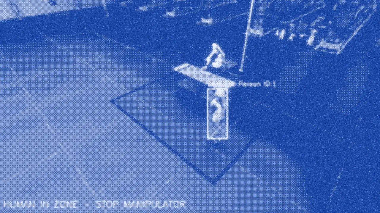 Frame from the clip: a simulated warehouse with a person boxed inside the marked zone around a manipulator, and the warning “HUMAN IN ZONE — STOP MANIPULATOR”.